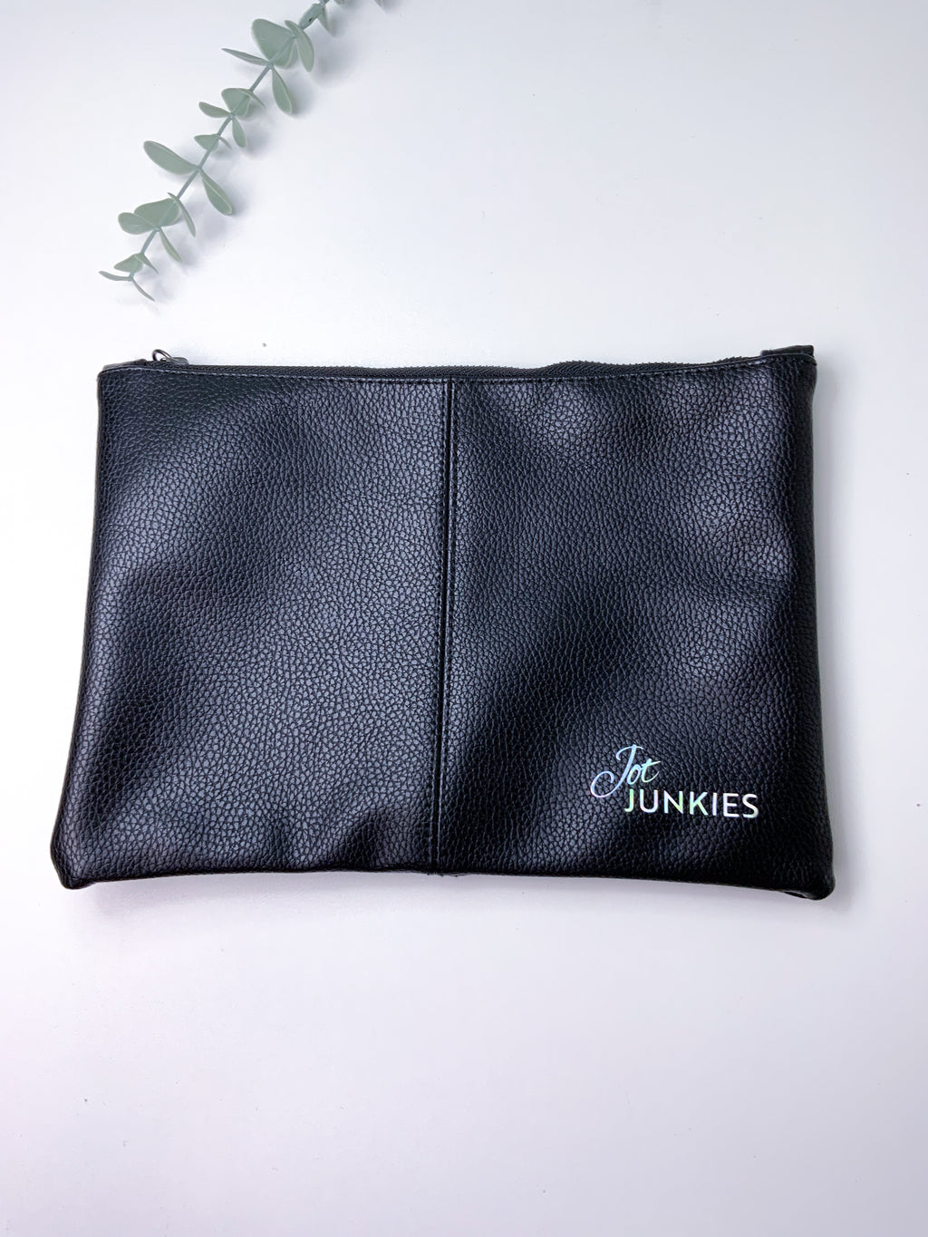 Black leather pouch with 'Jot Junkies' branding on a white background