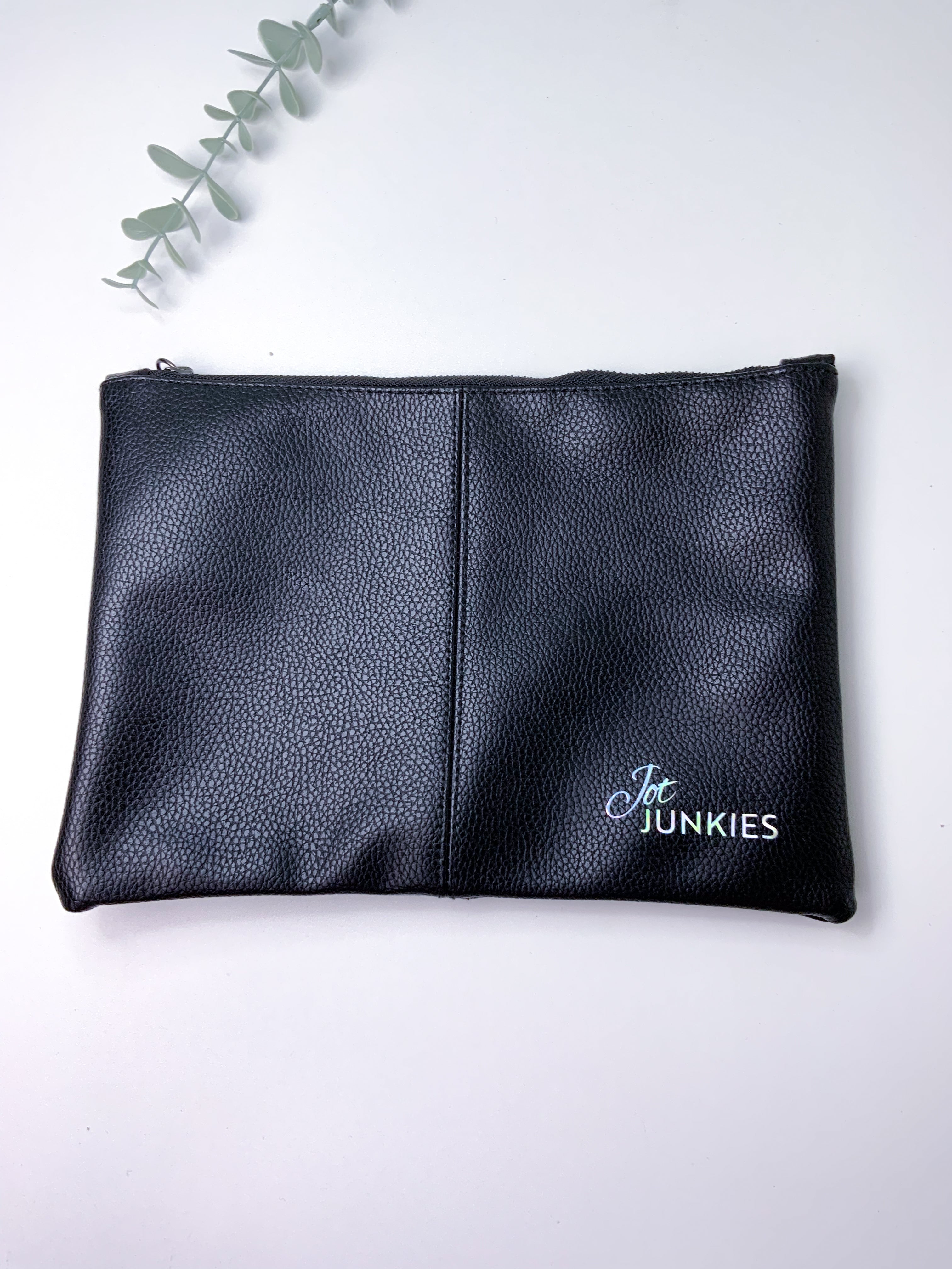 Black leather pouch with 'Jot Junkies' branding on a white background